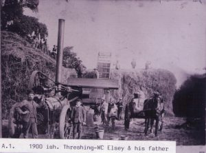 Threshing on one of the Village farms.